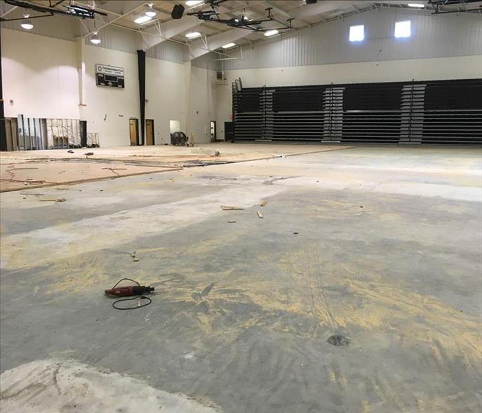 Removed flooring in large gym.
