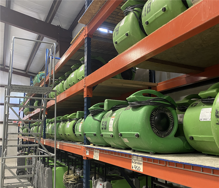 Air movers in warehouse.